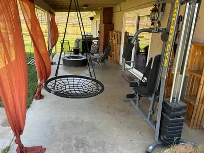 a back porch of an rv with a table and a grill at Peaceful & Cozy 3 bedroom Ranch-Home w/Fireplace in Hemet