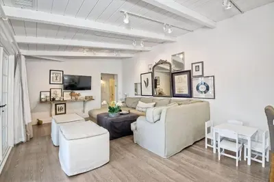 a living room with a couch and a table at Ocean Views, Across The Street From Beach, Private Patio in Carlsbad