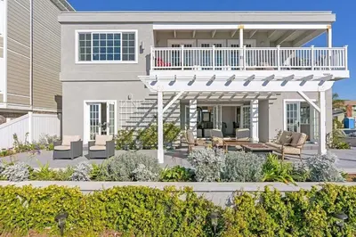 a large house with a porch and a balcony at Expansive Ocean View, Private Balcony, Across from Beach in Carlsbad