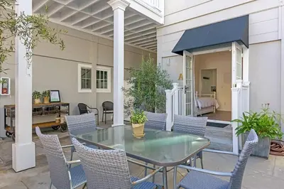 a patio with a glass table and chairs at Ocean View From Private Patio, Across Street From Beach in Carlsbad