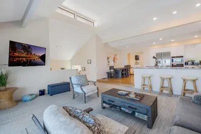 a living room with a couch and a table at Tattenham 1705 in Encinitas