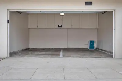 a large room with white cabinets in a garage at Tower 9 #1 in Oceanside