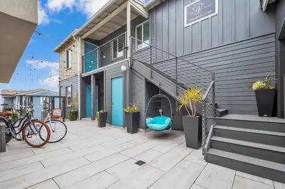 a building with bikes parked on a patio at Tower 9 #2 in Oceanside