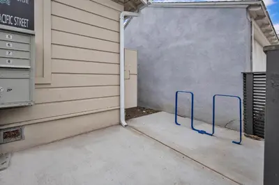 a garage door with blue handles in front of a building at Tower 9 #2 in Oceanside