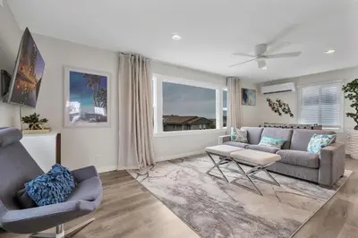 a living room with a couch and two chairs at Tower 9 #2 in Oceanside