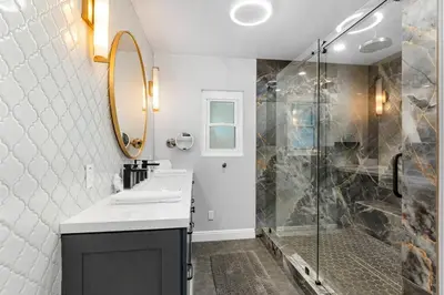 a bathroom with a sink and a shower at Designer 4 BR La Mesa Home w/ Yard and BBQ in La Mesa