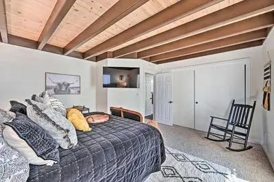 a bedroom with a bed and a wooden ceiling at Inviting Julian Home with Scenic View and Hot Tub in Julian