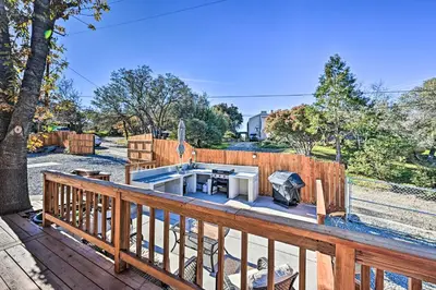 a deck with a grill and a barbecue on it at Inviting Julian Home with Scenic View and Hot Tub in Julian
