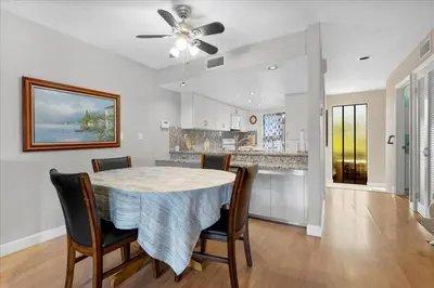 a kitchen and dining room with a table and chairs at Carlsbad Hideway Pool Spa in Carlsbad