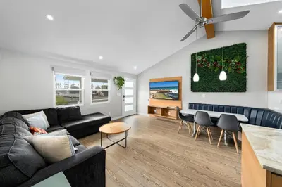 a living room with a couch and a table at Modern Luxury 2BR Apt in Heart of Ocean Beach in San Diego