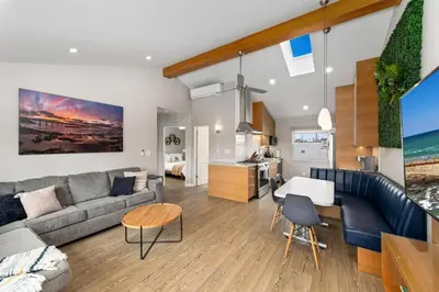 a living room with a couch and a table at 7BD Family, Event Friendly, 2 blocks to Beach, Boardwalk in San Diego