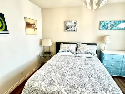 a bedroom with a bed and a blue dresser at Artsy smart home near Downtown & Balboa Park in San Diego
