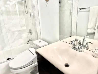 a bathroom with a sink and a toilet and a shower at Artsy smart home near Downtown & Balboa Park in San Diego