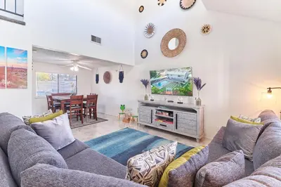 a living room with a couch and a tv at Entire Mountain Oasis Home in Hemet