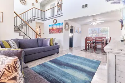 a living room with a couch and a table at Entire Mountain Oasis Home in Hemet