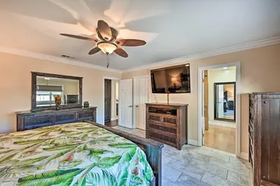 a bedroom with a bed and a ceiling fan at Vista Home with Pool about 11 Mi to Tamarack State Beach in Vista