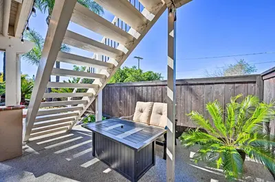 a patio with a table and a chair at Vista Home with Pool about 11 Mi to Tamarack State Beach in Vista