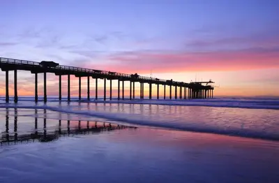 a pier on the beach with the ocean at On Site Parking King Master Suite UCSD Walk in San Diego