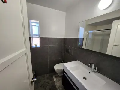 a bathroom with a sink and a toilet and a mirror at Private Room2 Own Entry Shared Bath One Guest Walk to UCSD in San Diego