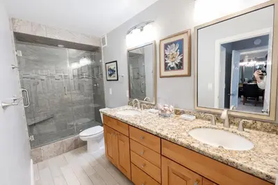 a bathroom with a sink and a shower at Ocean View Luxury Condo Oceanfront and Pool in San Diego