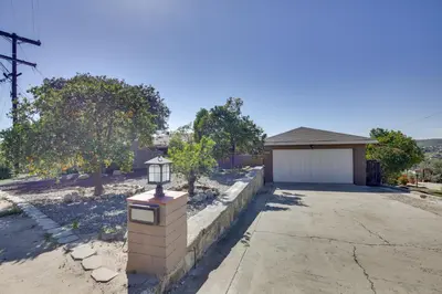 a brick mailbox in front of a garage at Charming Spring Valley Retreat with Private Pool! in Spring Valley