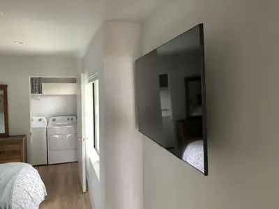 a mirror hanging on a wall in a bedroom at Smashing Newly-Built with Ocean/Bay/City Views! in San Diego
