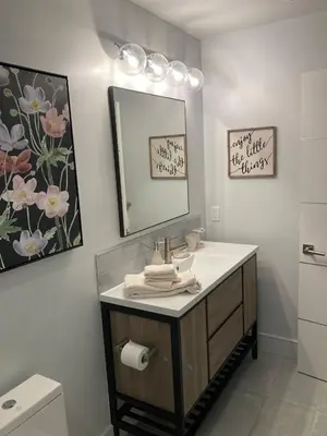 a bathroom with a sink and a mirror at Smashing Newly-Built with Ocean/Bay/City Views! in San Diego