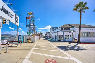 a street with a palm tree and a building at Newport Beach Vacation Rental - Short Walk to Pier in Newport Beach