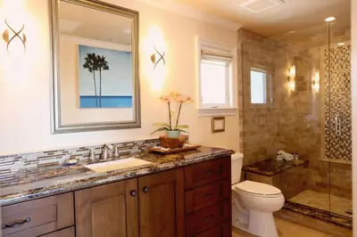a bathroom with a sink and a toilet and a shower at Villa D'Arte at the Retreat in Laguna Beach in Laguna Beach