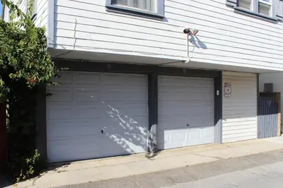 a pair of garage doors on the side of a house at 313 E Bay Ave B in Newport Beach