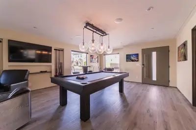 a pool table in the middle of a room at 501 E Bay Ave in Newport Beach