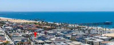 an aerial view of a beach and the ocean at Pier to Pier in Newport Beach