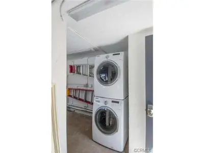 a washing machine and a dryer in a room at 313 E Bay Ave A & B in Newport Beach