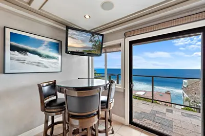 a dining room with a view of the ocean at Villa Leone at the Retreat in Laguna Beach in Laguna Beach