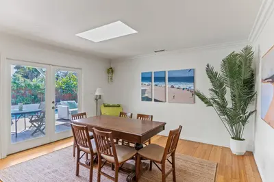 a dining room with a table and chairs at Luxury Beach House. Pool/Hot Tub! Walk to Beach! in Carlsbad