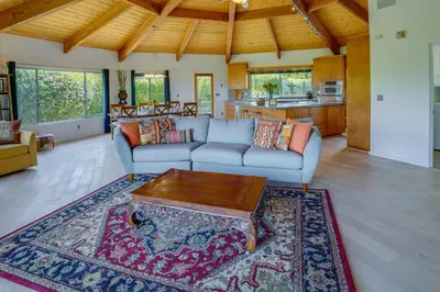 a living room with a couch and a coffee table at Fallbrook Home with Mountain Views Close to Hiking! in Fallbrook