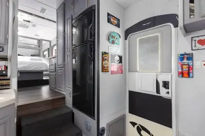 a small train room with a bed and a hallway at Harley Davidson Ranch Glampling With Kids Play Zone in Ramona