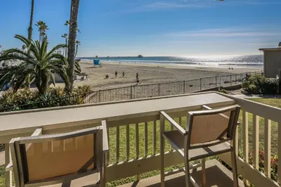 a balcony with a view of the beach at D10 - Tranquil Haven at the Beach in Oceanside