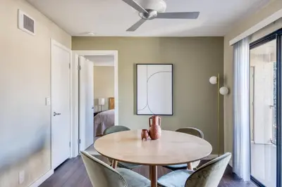 a dining room with a table and chairs at La Jolla 1br w gym wd pool nr bars shops SAN-7 in San Diego