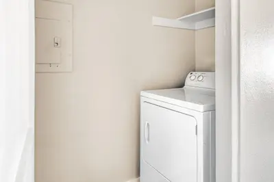 a white laundry room with a washer and dryer at La Jolla 1br w gym wd pool nr bars shops SAN-7 in San Diego