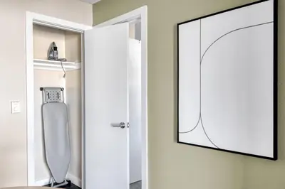 a mirror hanging on a wall in a bathroom at La Jolla 1br w gym wd pool nr bars shops SAN-7 in San Diego
