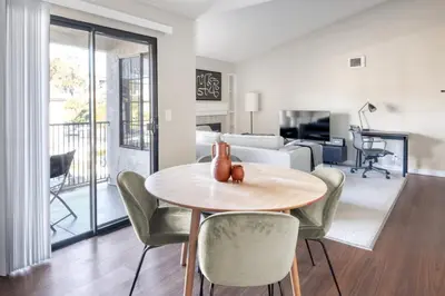 a living room with a table and chairs at La Jolla 1br w gym wd pool nr bars shops SAN-7 in San Diego