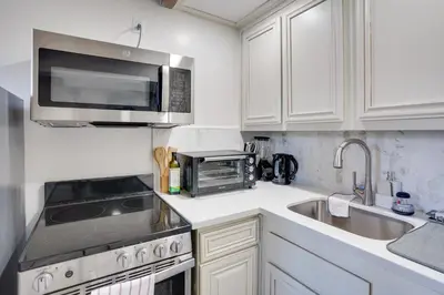 a kitchen with a microwave and a sink at Newport Beach Vacation Rental Near Beach and Pier in Newport Beach
