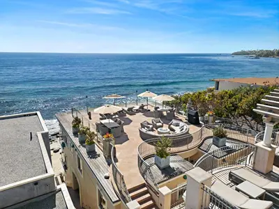 a view of the ocean from the balcony of a resort at Villa Calypso in Laguna Beach