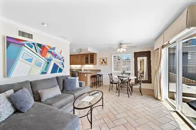 a living room with a couch and a table at Villa Calypso in Laguna Beach
